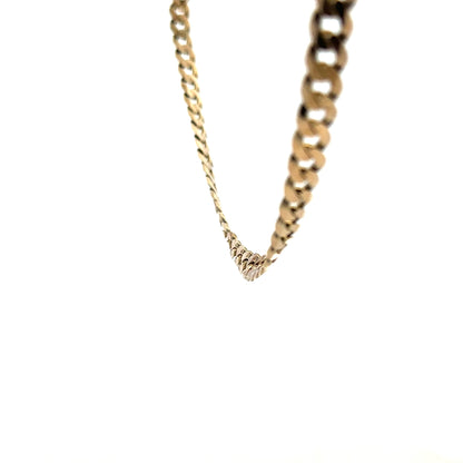 9ct yellow gold curb chain weighing 25.4g, unbranded jewelry chain with a classic link design.