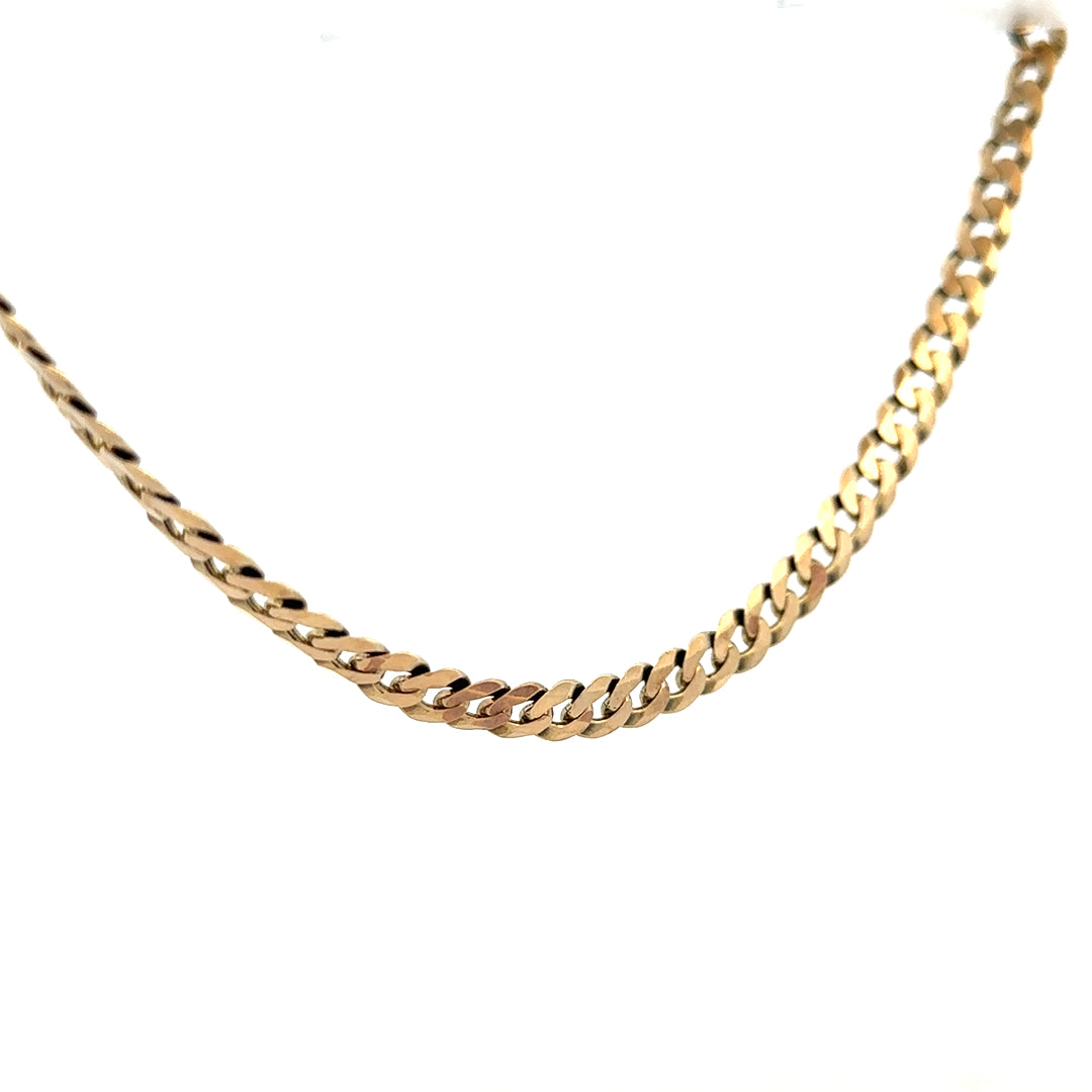 9ct yellow gold curb chain weighing 25.4g, unbranded jewelry chain with a classic curb link design.