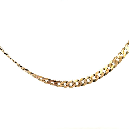 9ct yellow gold curb chain weighing 25.4g, featuring classic linked design, unbranded jewelry accessory on a plain background.