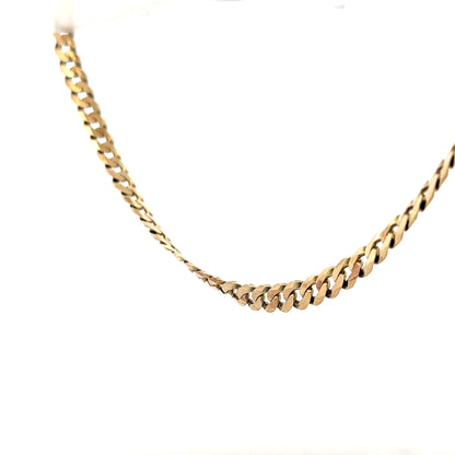 9ct yellow gold curb chain with a sturdy design, weighing 25.4g, featuring classic links and a polished finish.