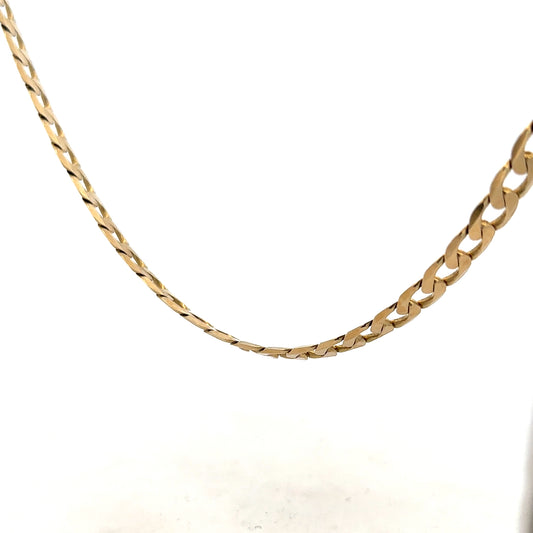 9ct yellow gold curb chain weighing 30.3g, showcasing a classic jewelry chain design with a polished finish.