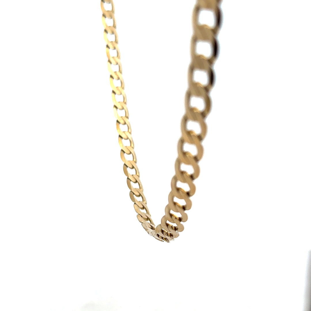 9ct yellow gold curb chain, unbranded, with a weight of 30.3 grams, featuring a classic linked design.