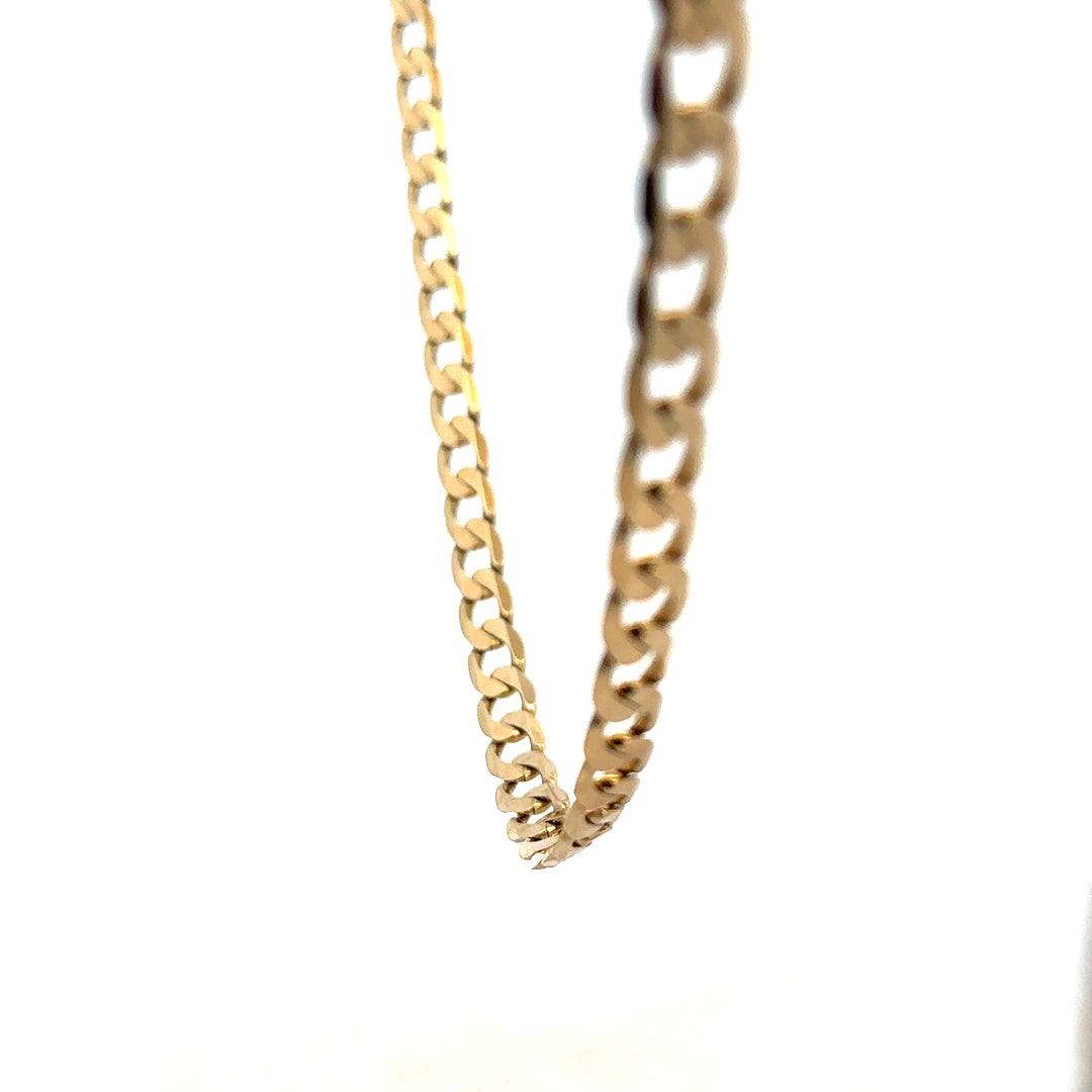 9ct yellow gold curb chain weighing 30.3g, featuring a classic linked design, unbranded jewelry accessory.