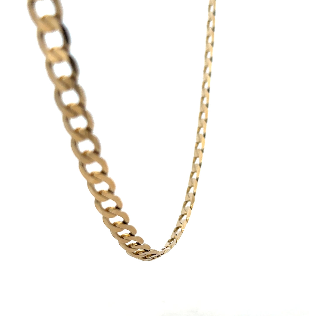 9ct yellow gold curb chain weighing 30.3g, featuring classic interlinked design, unbranded jewelry chain for men or women.