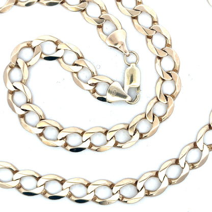 9ct yellow gold curb chain, unbranded, showing the detailed links and polished finish, weighs 53.9 grams.