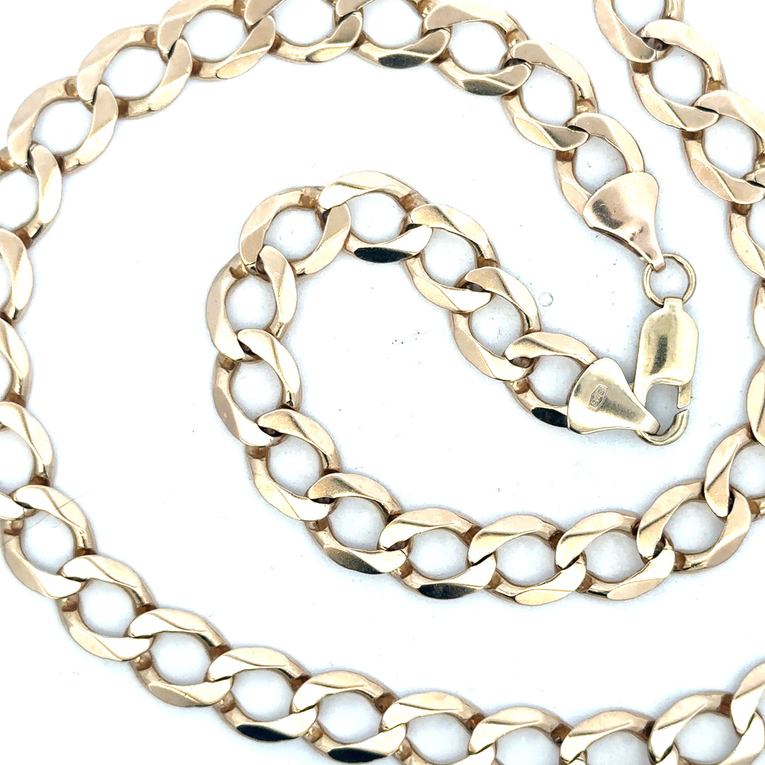 9ct yellow gold curb chain weighing 53.9g, unbranded jewelry chain with a classic curb link design.