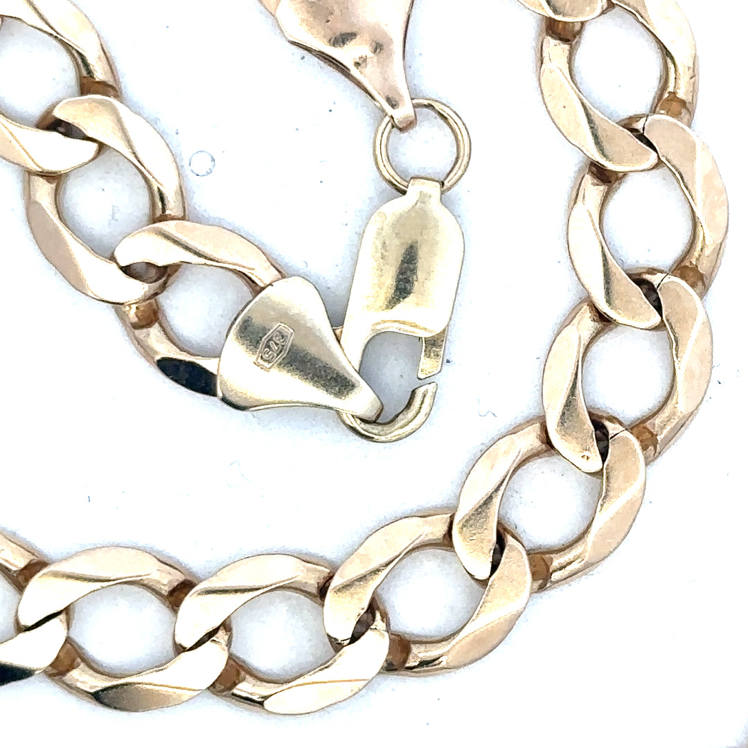9ct yellow gold curb chain weighing 53.9g, unbranded jewelry chain with a classic design and polished finish.