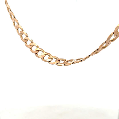 9ct yellow gold curb chain, unbranded, weighing 61.2g, showcasing polished links with a secure clasp.