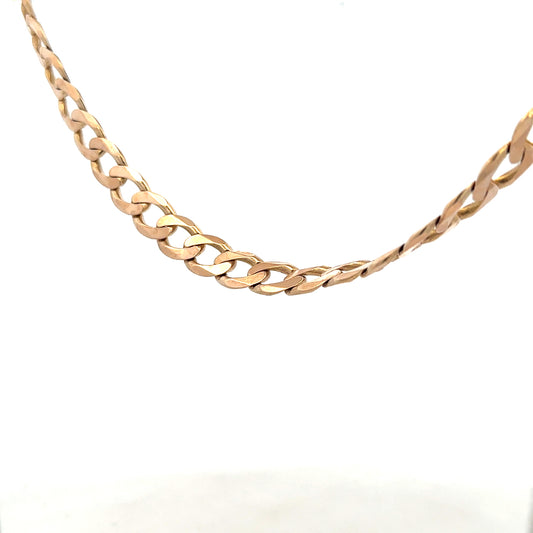 9ct yellow gold curb chain, unbranded, weighing 61.2g, showcasing polished links with a secure clasp.