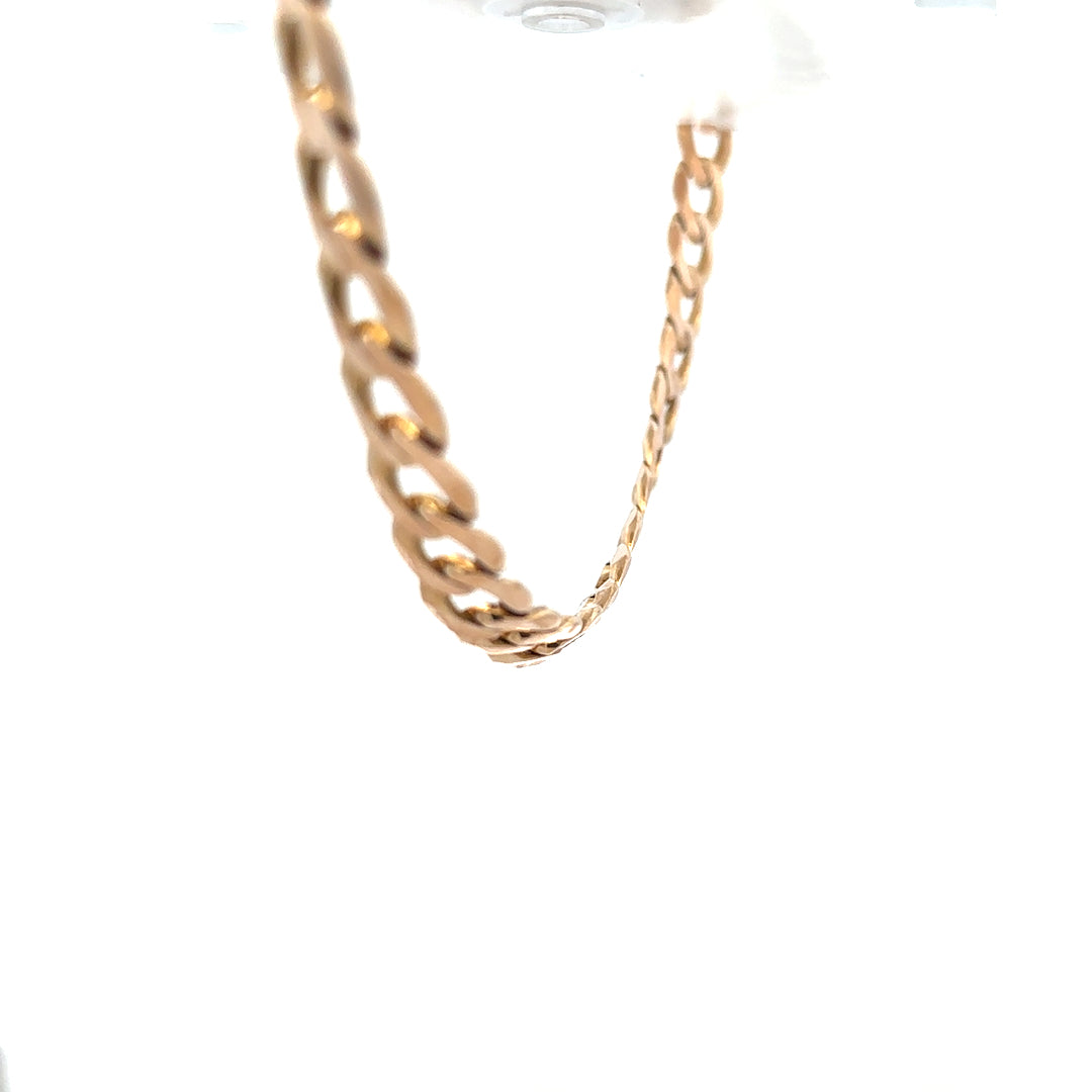 9ct yellow gold curb chain weighing 61.2g, unbranded, featuring classic interlinked design on a plain background.