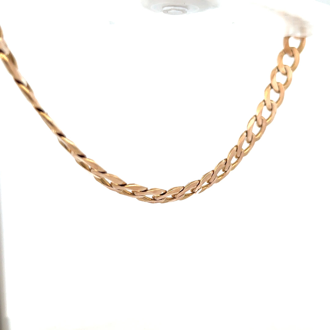 9ct yellow gold curb chain showing its textured links, weighing 61.2 grams, unbranded jewelry chain for men or women.