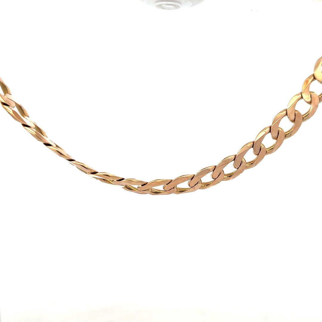 9ct yellow gold curb chain weighing 61.2g, unbranded, showing a close-up of the chain's links and gold finish.