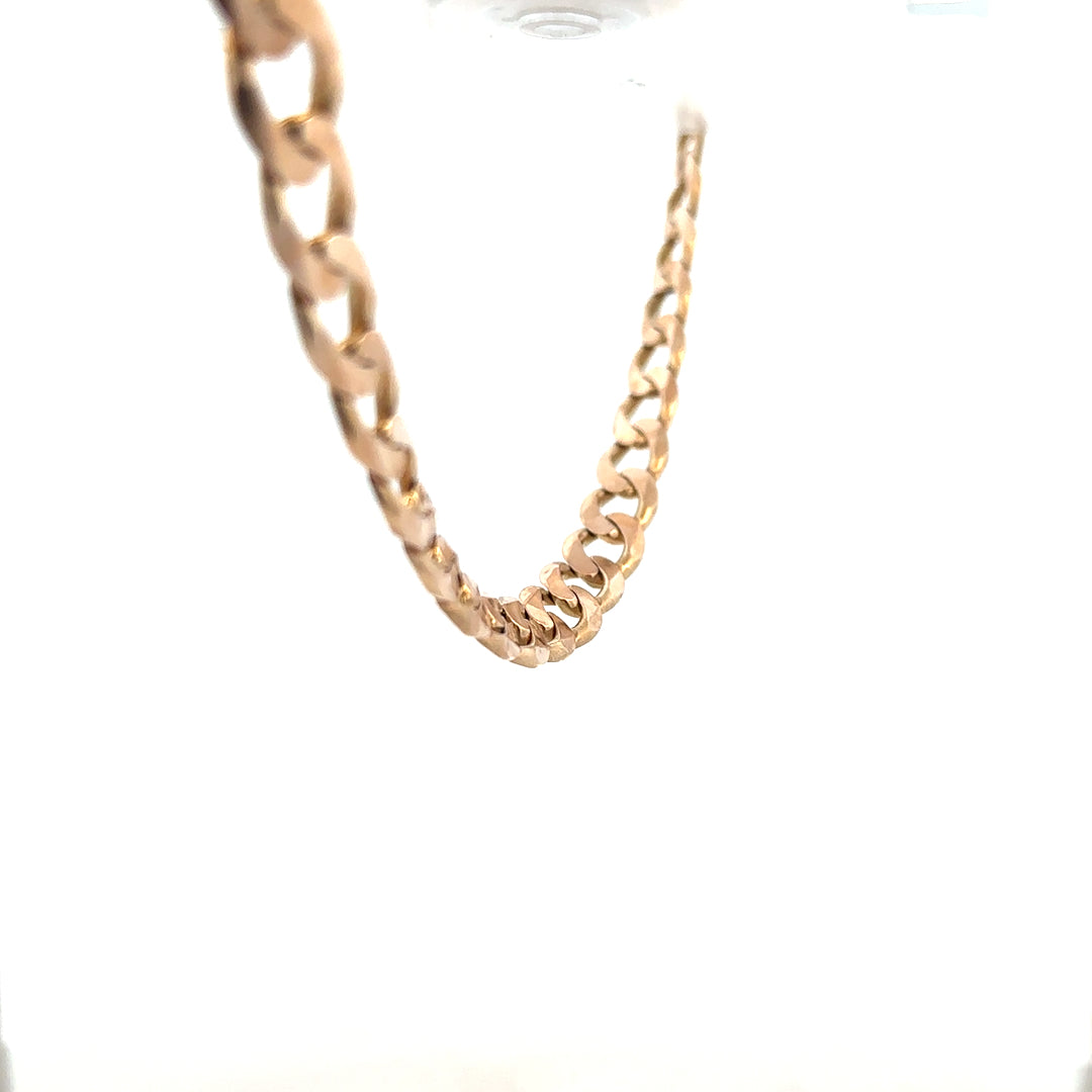 9ct yellow gold curb chain, unbranded, weighing 61.2g, showing the detailed links and shiny polished finish.
