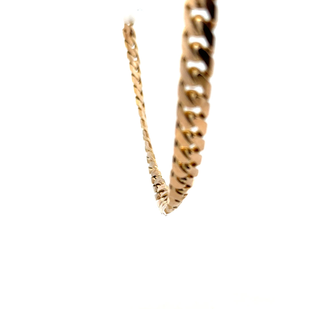 9ct yellow gold curb chain, unbranded, weighs 61.4g, with a classic linked design, shown in a close-up image.