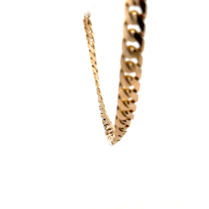 9ct yellow gold curb chain, unbranded, weighs 61.4g, with a classic linked design, shown in a close-up image.