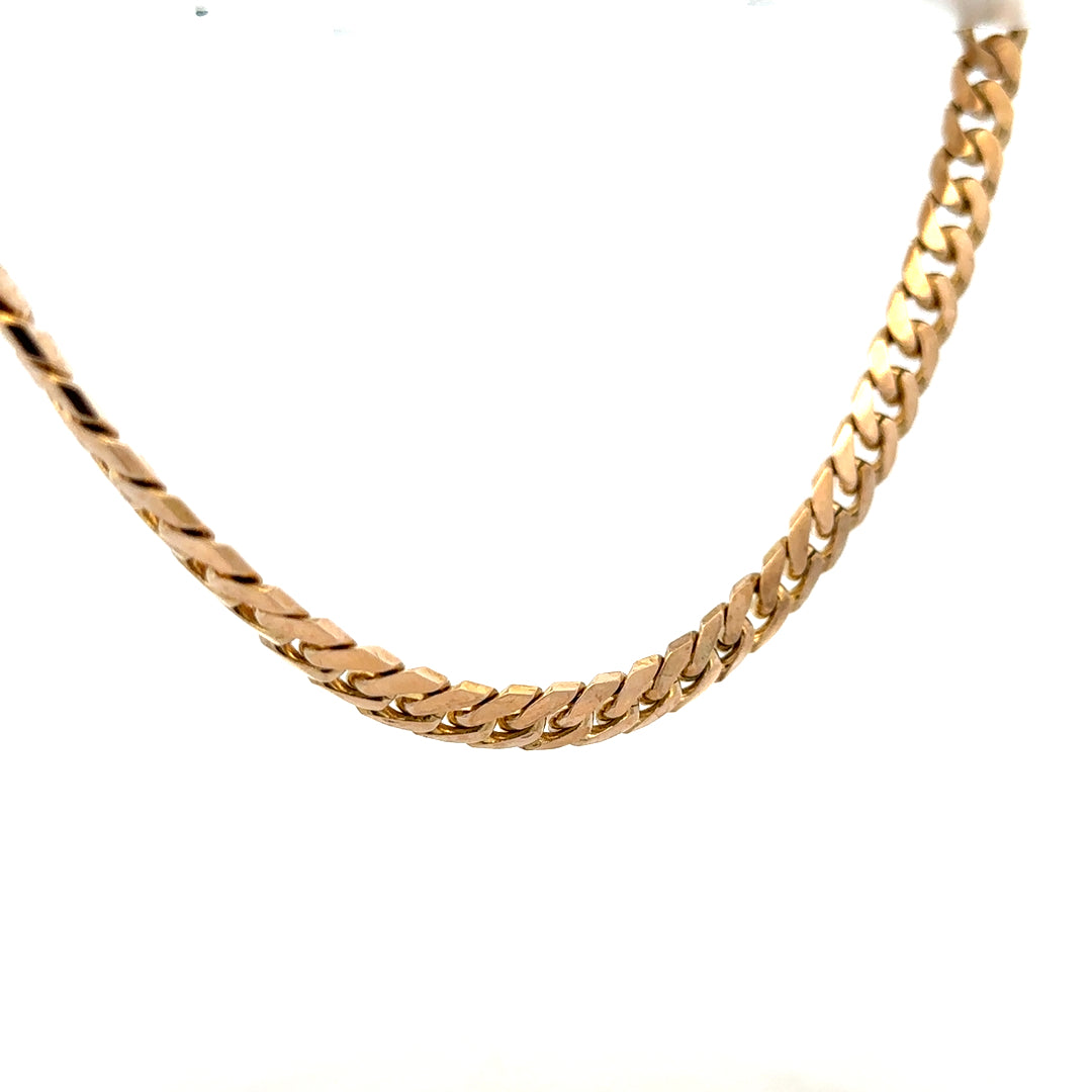 9ct yellow gold curb chain weighing 61.4g, showcasing a classic linked jewelry chain with a polished finish.