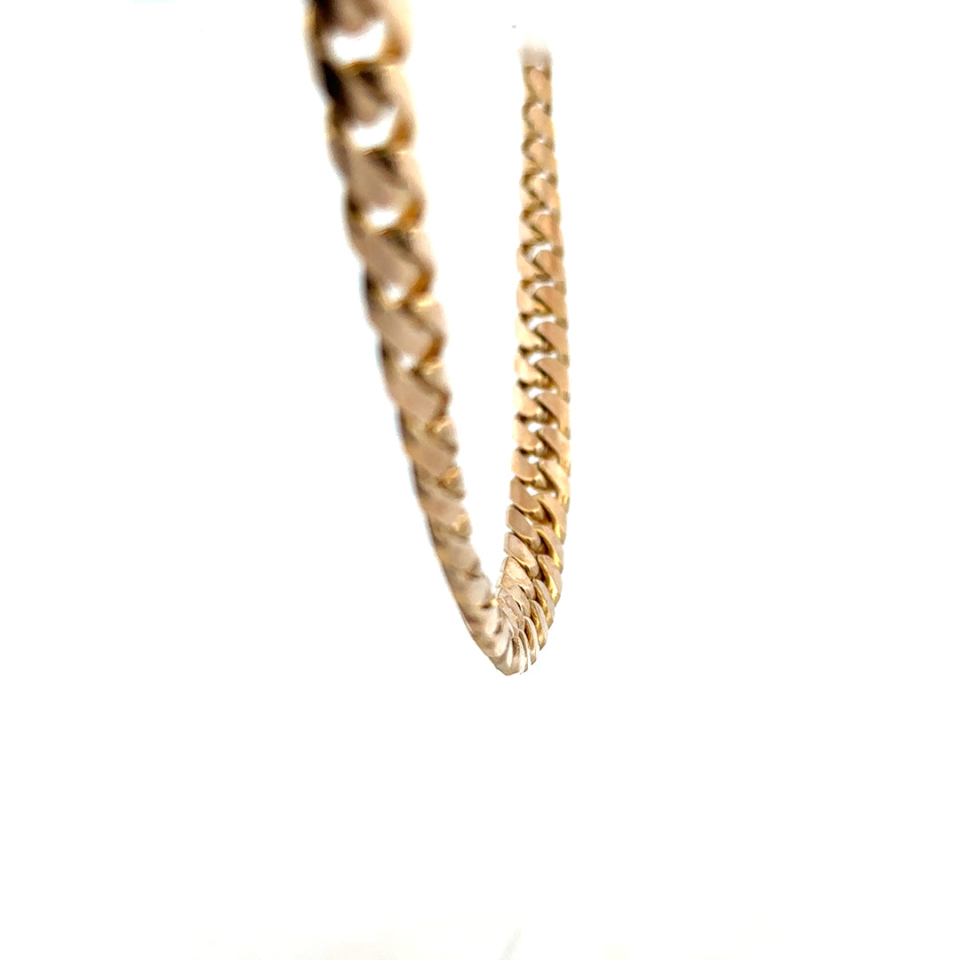 9ct yellow gold curb chain weighing 61.4g, unbranded jewelry chain with a classic curb link design.