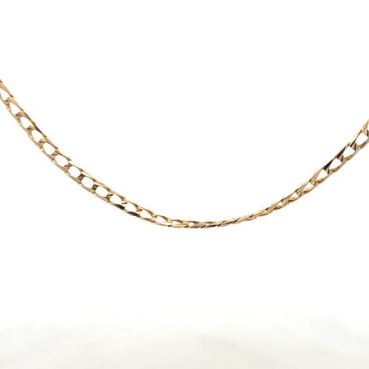 9ct yellow gold curb chain weighing 9.9g, unbranded jewelry chain with classic design, shown in close-up image.