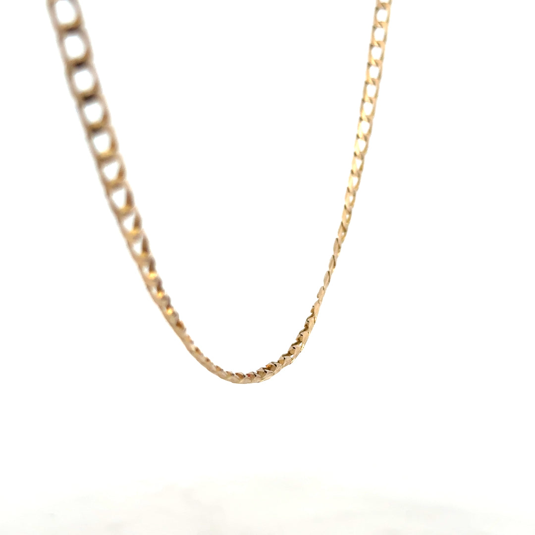 9ct yellow gold curb chain, unbranded, weighing 9.9 grams, featuring classic interlinked design visible in the image.