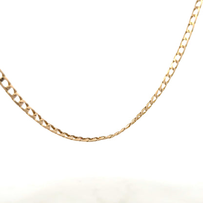 9ct yellow gold curb chain weighing 9.9g, unbranded jewelry chain with a classic curb link design.