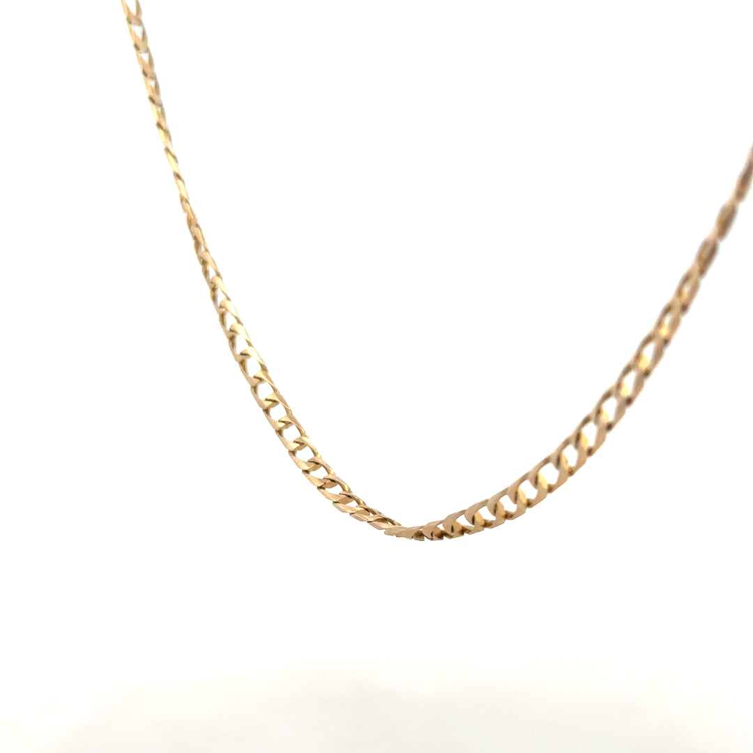 9ct yellow gold curb chain weighing 9.9g, showcasing a classic jewelry chain with a polished finish and sturdy links.