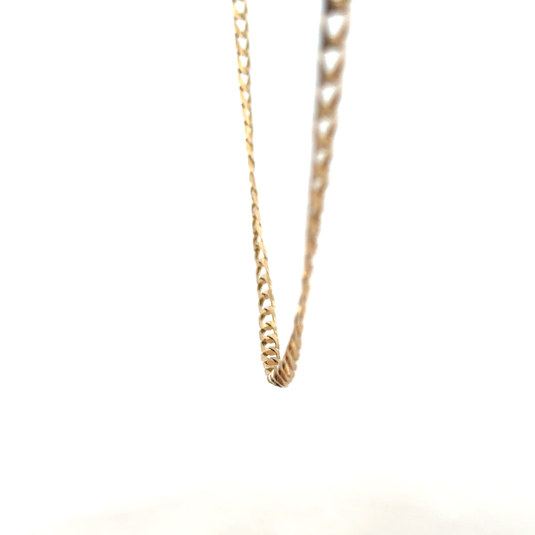 9ct yellow gold curb chain weighing 9.9g, unbranded jewelry chain with classic curb link design.
