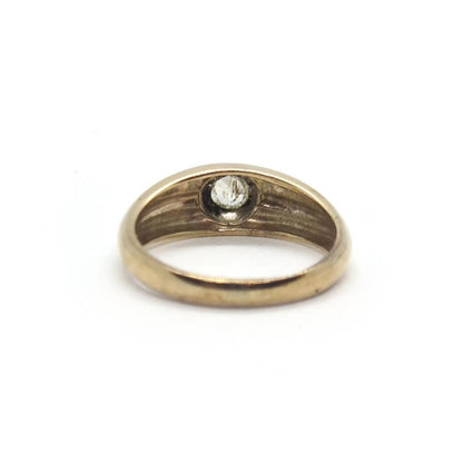 9ct yellow gold diamond ring with a polished finish, featuring a central sparkling diamond on a simple band.