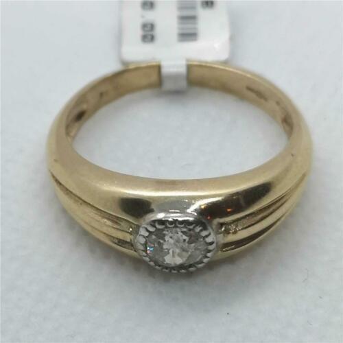 9ct yellow gold diamond ring featuring a sparkling central diamond and a polished band.