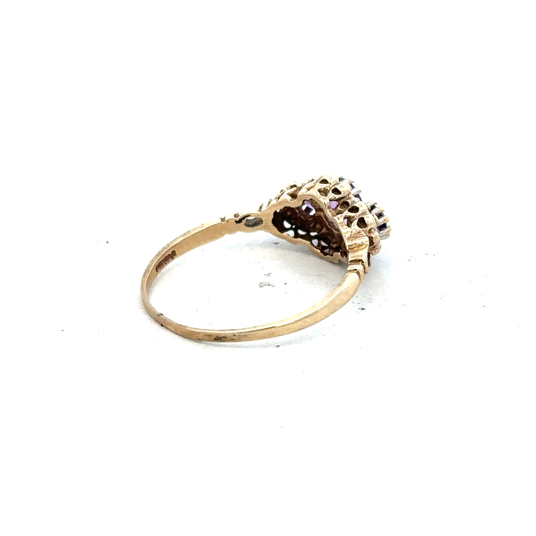 9ct yellow gold ring with diamond and amethyst gemstones, size Q, featuring a stylish and elegant design.