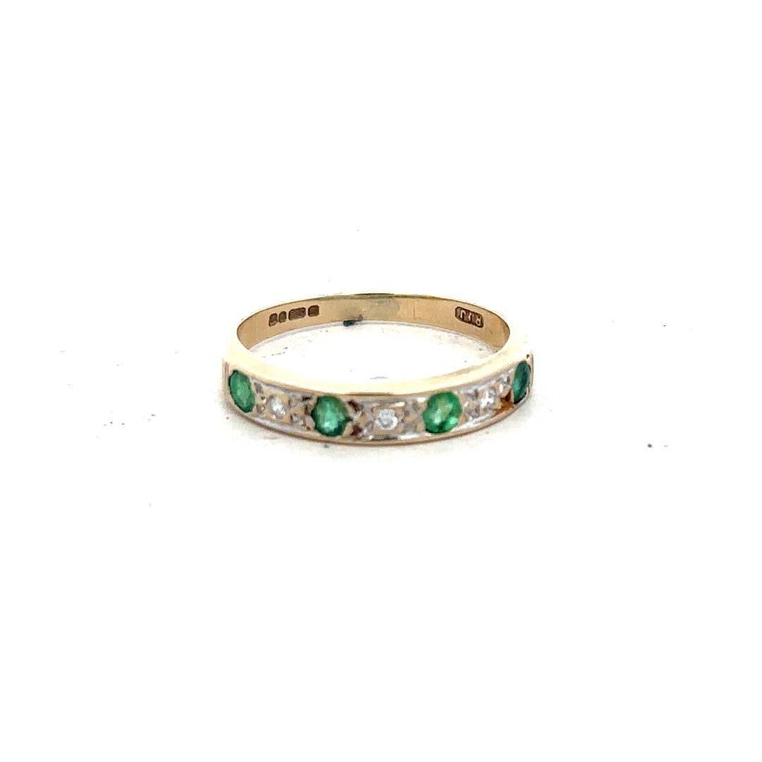 9ct yellow gold ring featuring diamonds and emeralds, size K, showcasing intricate gemstone design and luxurious craftsmanship.