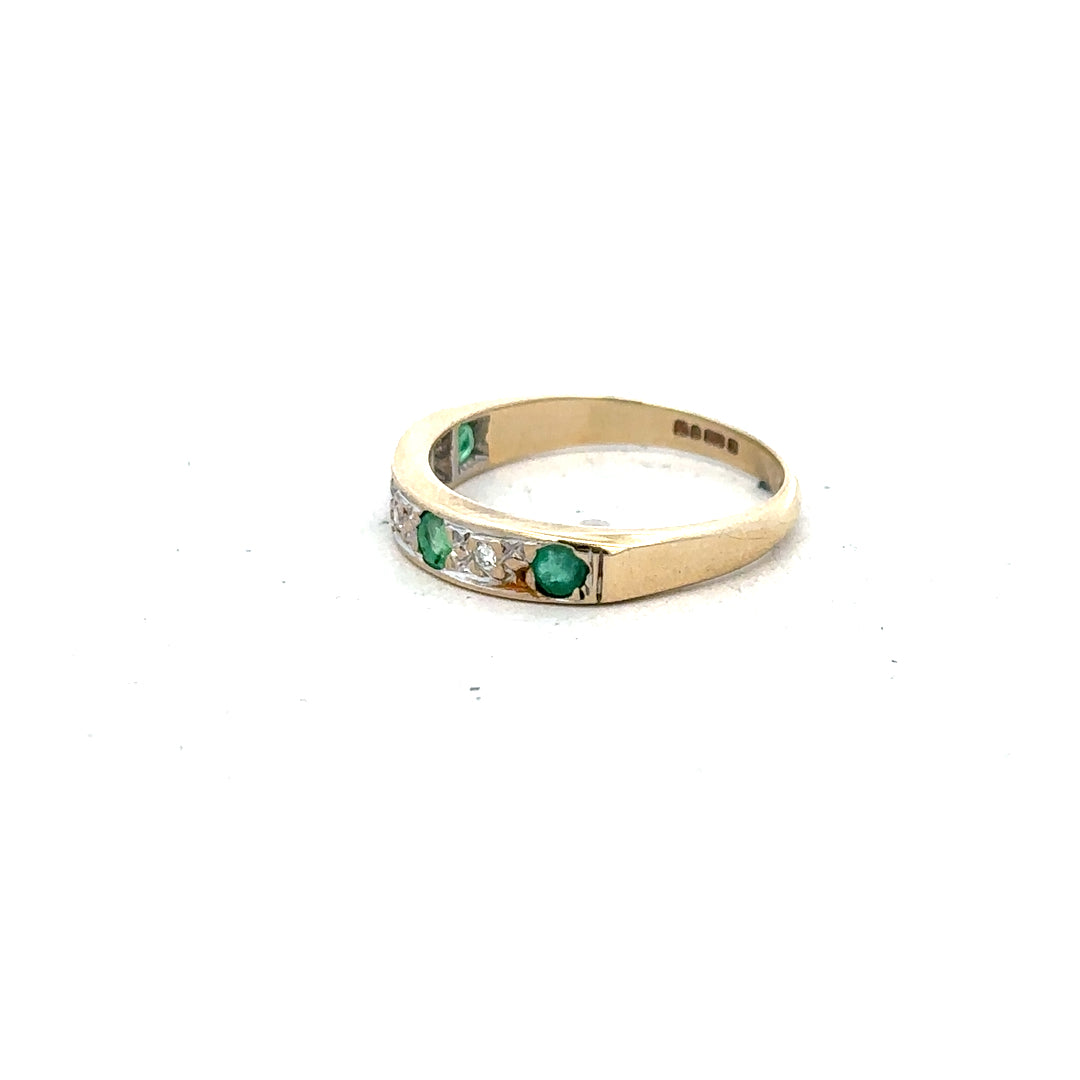 9ct yellow gold ring featuring diamonds and emeralds, size K, with intricate gemstone and gold band details.