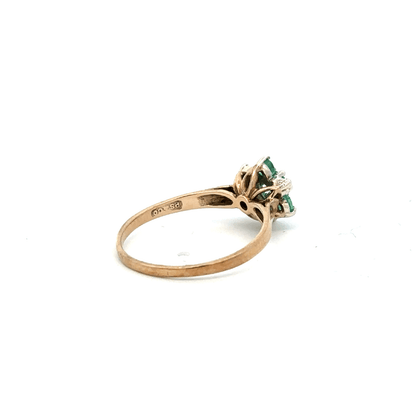 9ct yellow gold ring with diamond and emerald accents, size O, featuring a detailed design and gemstone setting.