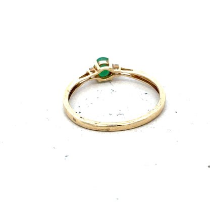 9ct yellow gold diamond and emerald ring in size S, featuring a detailed design and sparkling gemstones.