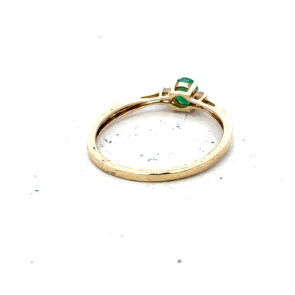 9ct yellow gold diamond and emerald ring in size S, featuring a detailed design with sparkling stones and gold band.