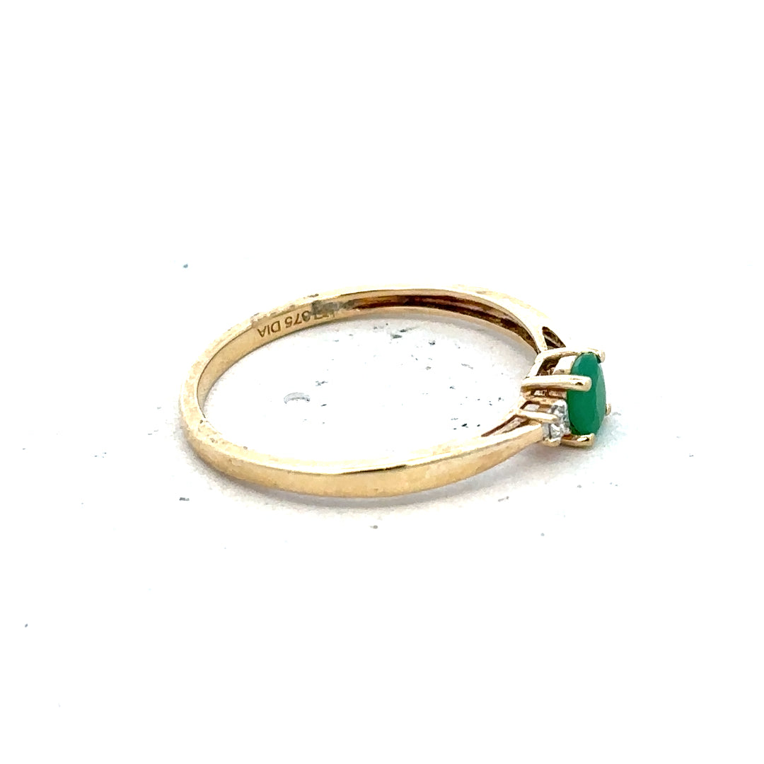 9ct yellow gold ring with diamonds and emeralds, size S, showcasing intricate gemstone and gold band design.