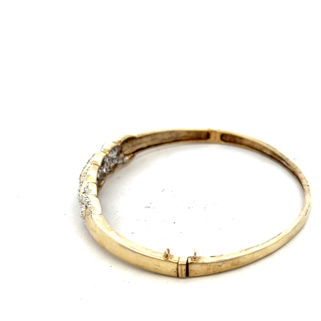 9ct yellow gold diamond bracelet with intricate design, featuring sparkling diamonds and a polished finish.