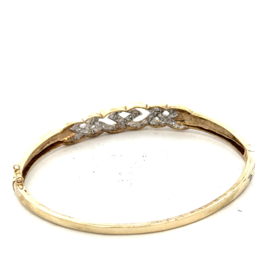 9ct yellow gold diamond bangle bracelet with a smooth design, weighing 10g, unbranded jewelry accessory.