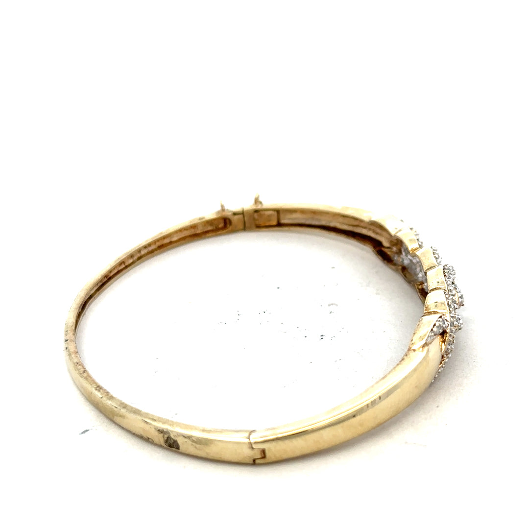 9ct yellow gold diamond bangle bracelet with intricate design, weighing 10g, unbranded jewelry piece.