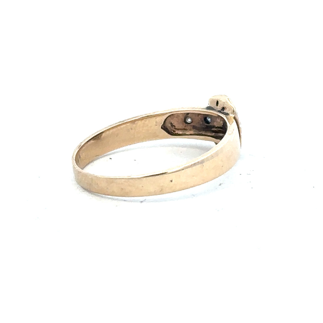 9ct yellow gold diamond buckle ring in size R with intricate design, showcasing a sparkling diamond accent on a stylish band.
