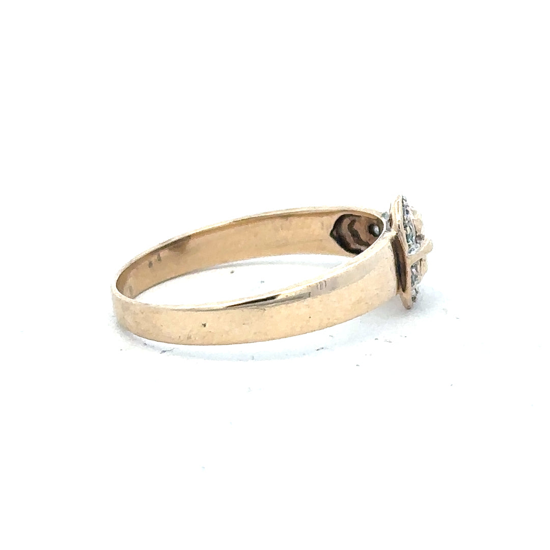 9ct yellow gold diamond buckle ring in size R, featuring a polished gold band with a decorative diamond-encrusted buckle detail.