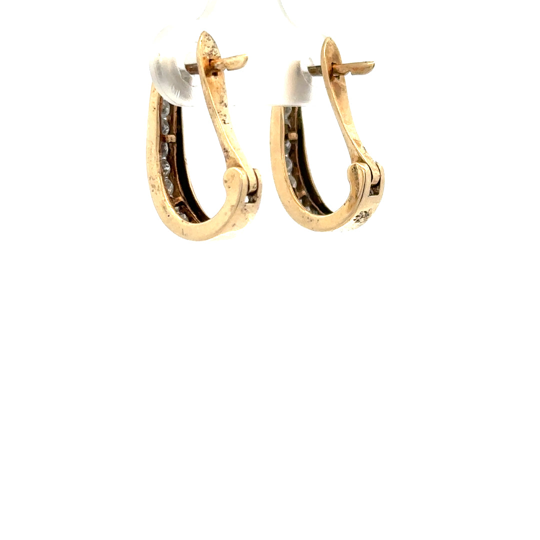 9ct yellow gold diamond earrings with delicate design, weighing 3.1g, featuring sparkling diamonds on elegant earring posts.