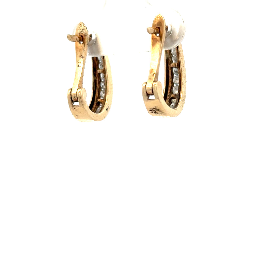 9ct yellow gold diamond earrings with sparkling diamonds, weighing 3.1g, shown on a neutral background.