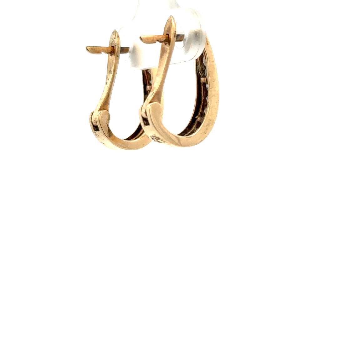 9ct yellow gold diamond earrings featuring sparkling diamonds, weighing 3.1g, with a classic and elegant design.