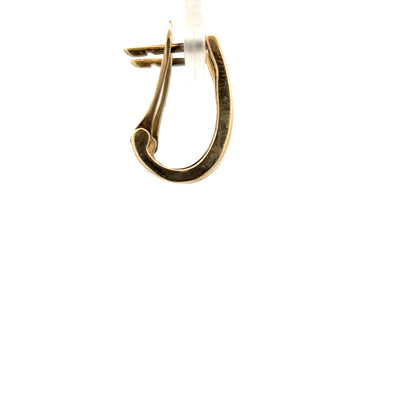 9ct yellow gold diamond earrings with sparkling stones, weighing 3.1g, featuring a classic design and unbranded craftsmanship.