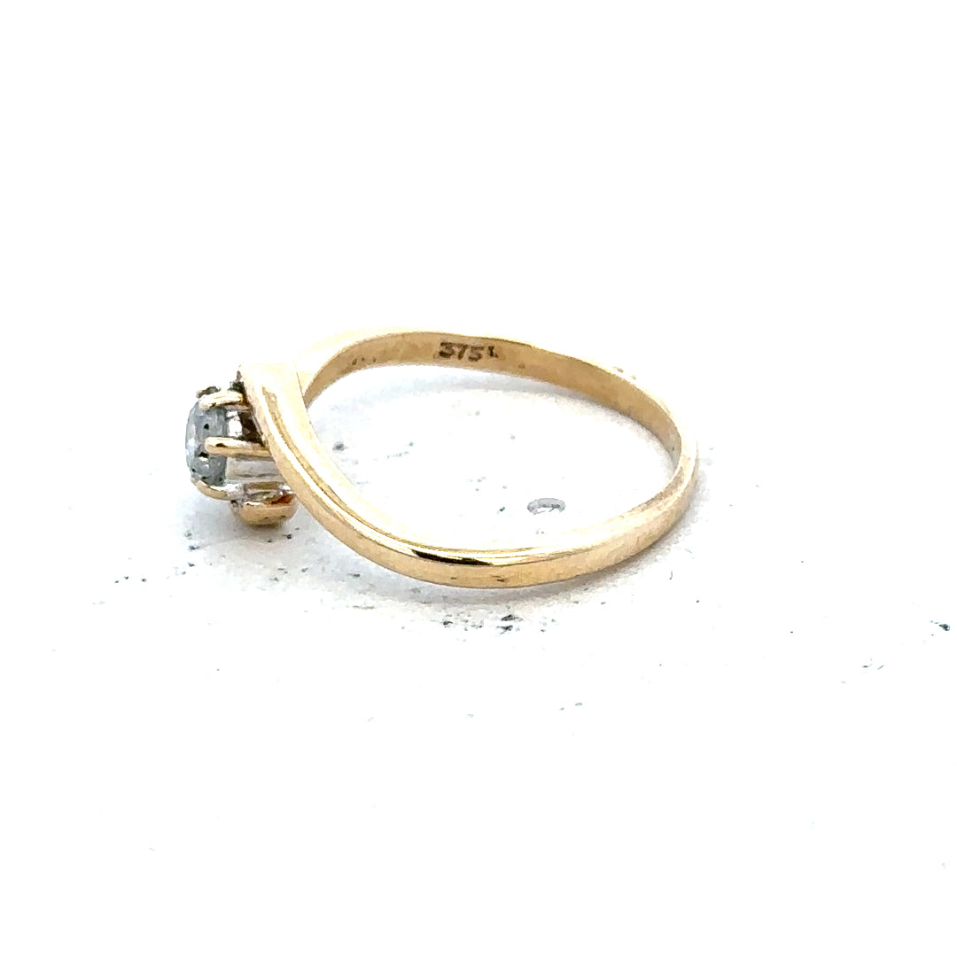 9ct yellow gold diamond ring, size I 1/2, unbranded jewelry, showcasing a delicate gold band with a sparkling diamond accent.