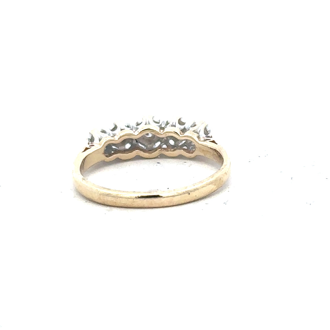 9ct yellow gold diamond ring in size J, featuring a sparkling diamond centerpiece and a polished band.