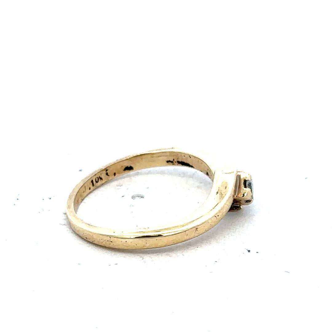 9ct yellow gold diamond ring in size K 1/2, featuring sparkling diamonds and weighing 2.3 grams.