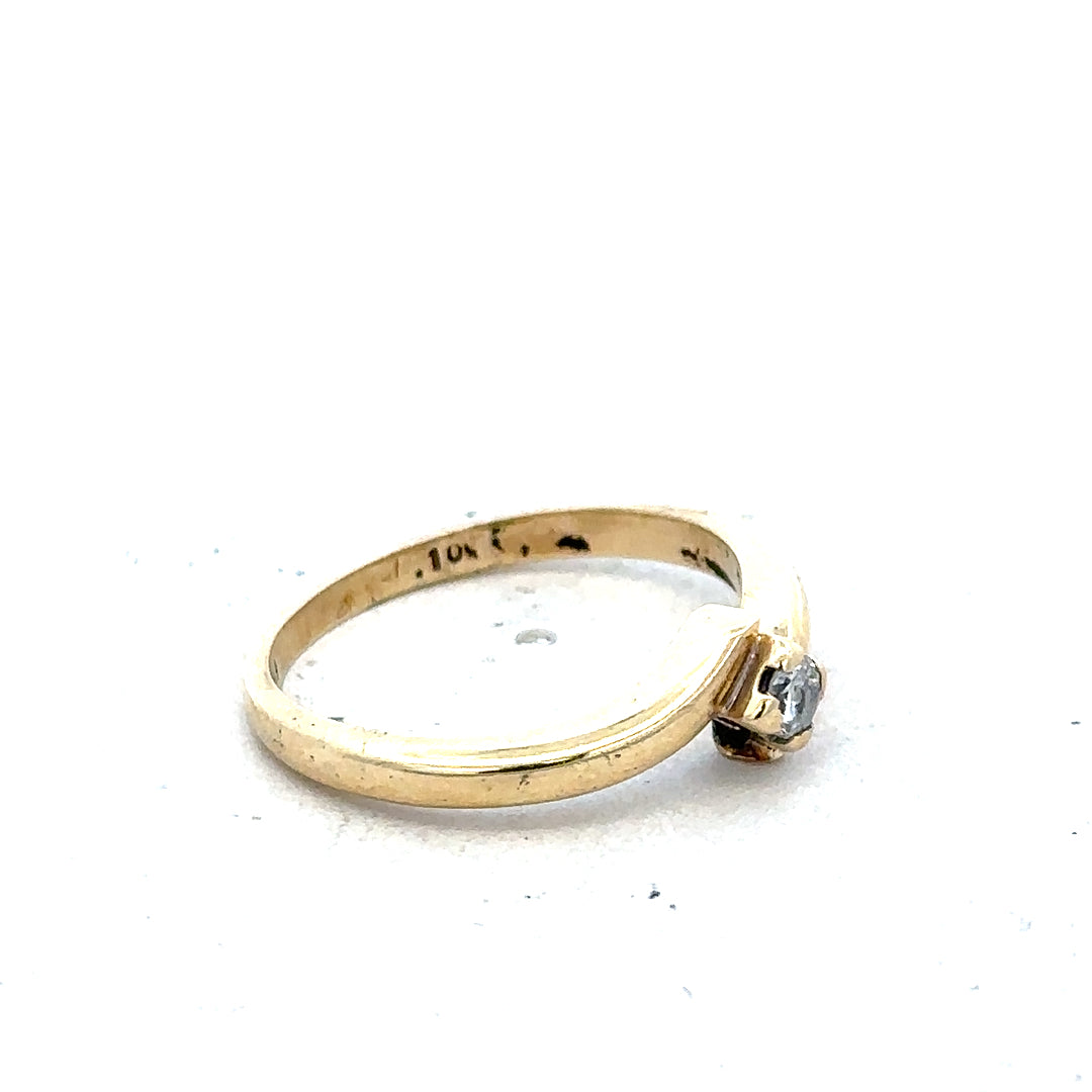 9ct yellow gold diamond ring in size K 1/2 featuring sparkling diamonds, weighs 2.3 grams, unbranded jewelry accessory.