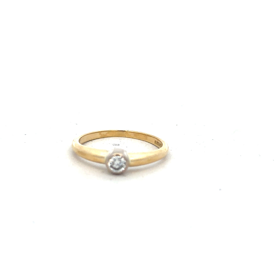 9ct yellow gold diamond ring in size K with sparkling diamonds, unbranded jewelry piece displayed on a neutral background.