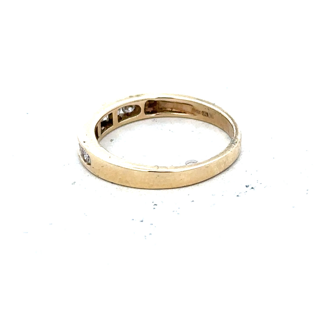 9ct yellow gold diamond ring in size K1/2, showcasing a sparkling diamond set in a sleek gold band.